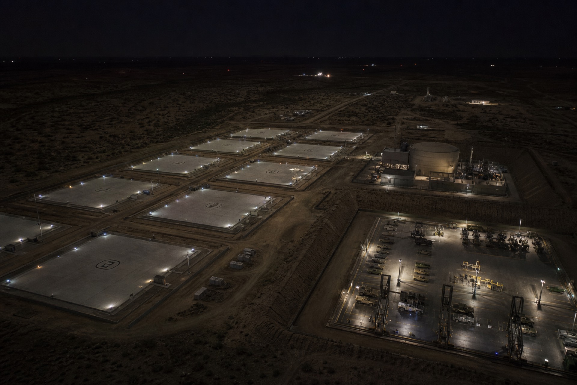 Night approach to an off-grid Safelz drone hive in desert terrain